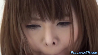 Oriental teen pisses herself
